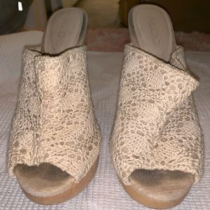 Cream colored, lace high heels. Very lightly worn